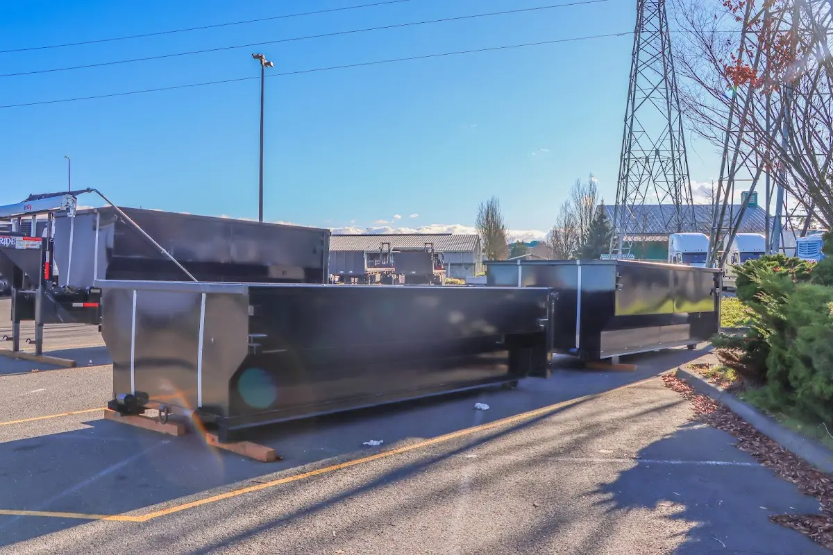 Roll-off dumpster ready for waste disposal at job site for 2 Yard Dumpster Rental in Hendersonville